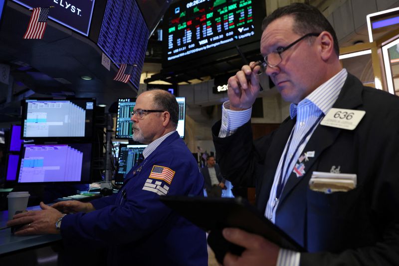 Wall Street closes lower as investors assess data after recent gains