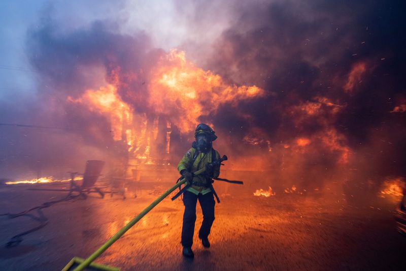 Wildfires rage in Los Angeles, forcing tens of thousands to flee