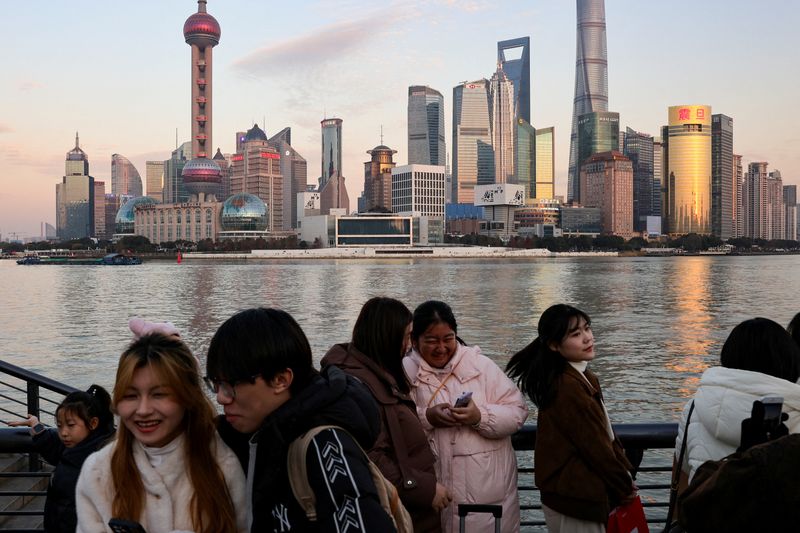 China's economy meets official growth target, but many feel a downturn